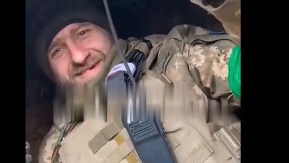 Georgian militants Fire Back from a Trench - in which their less fortunate Comrades are already lying.